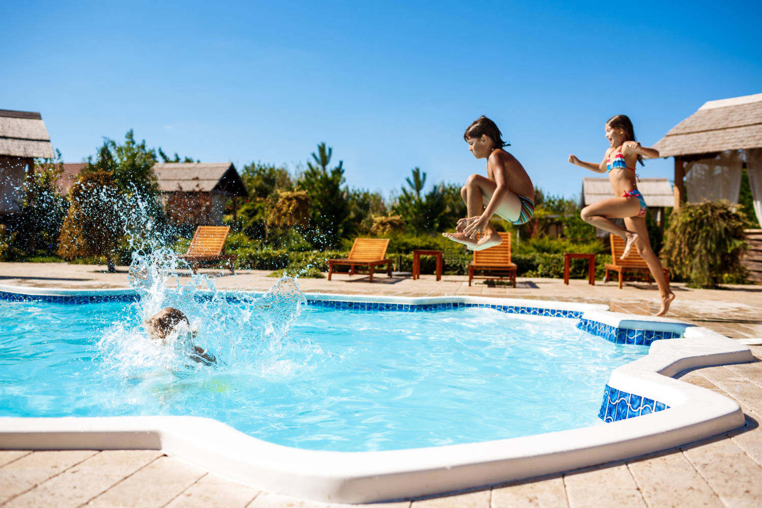 cheerful-children-rejoicing-jumping-swimming-in-pool.jpg